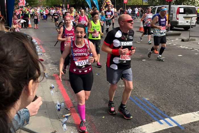 Marathon runner seeing a friend in the crowd 